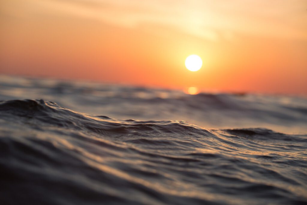 Photo: Sun setting over waves