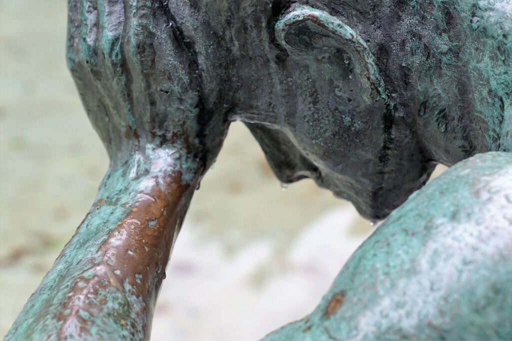 Statue: Man contemplating