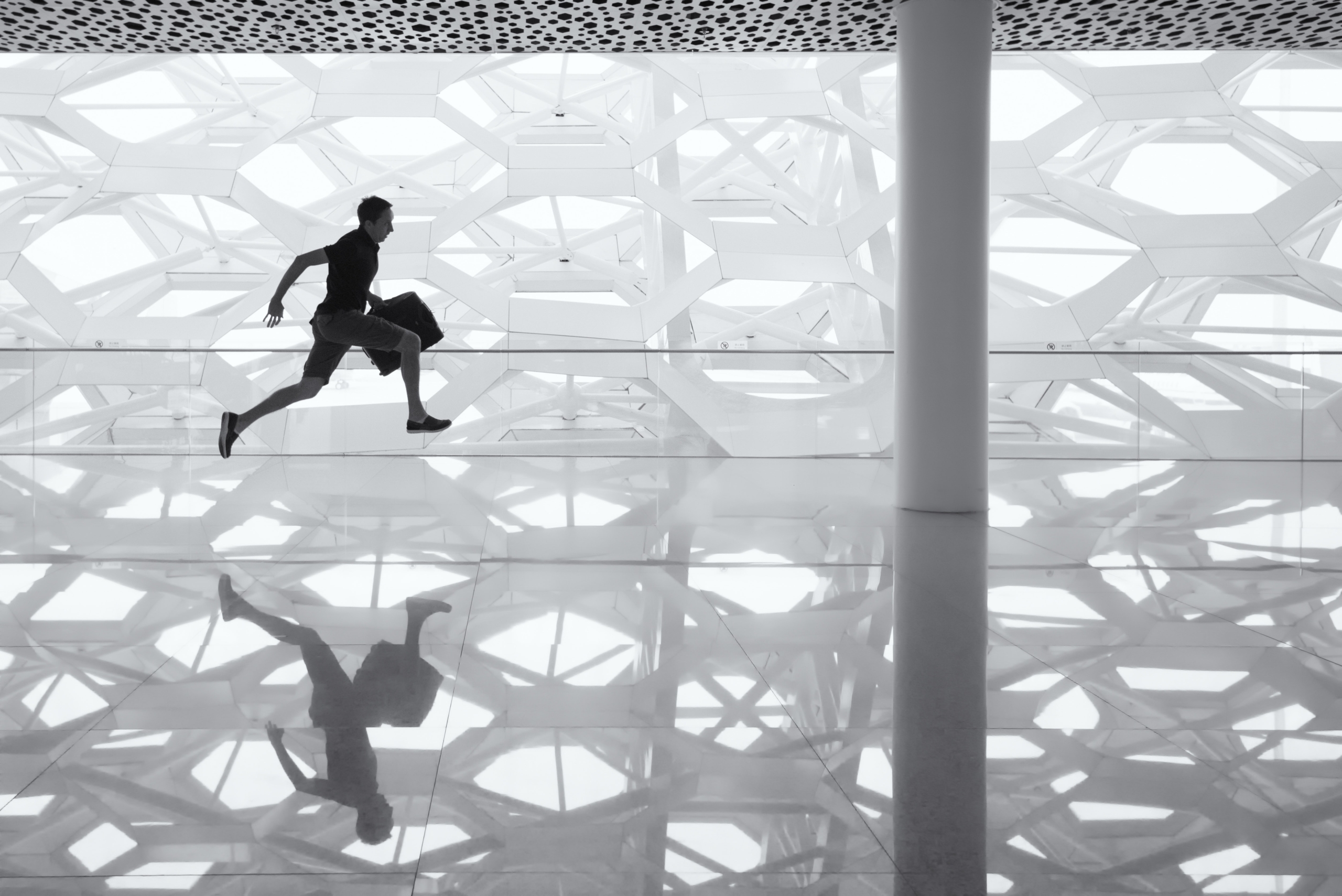 Photo: Man running with suitcase